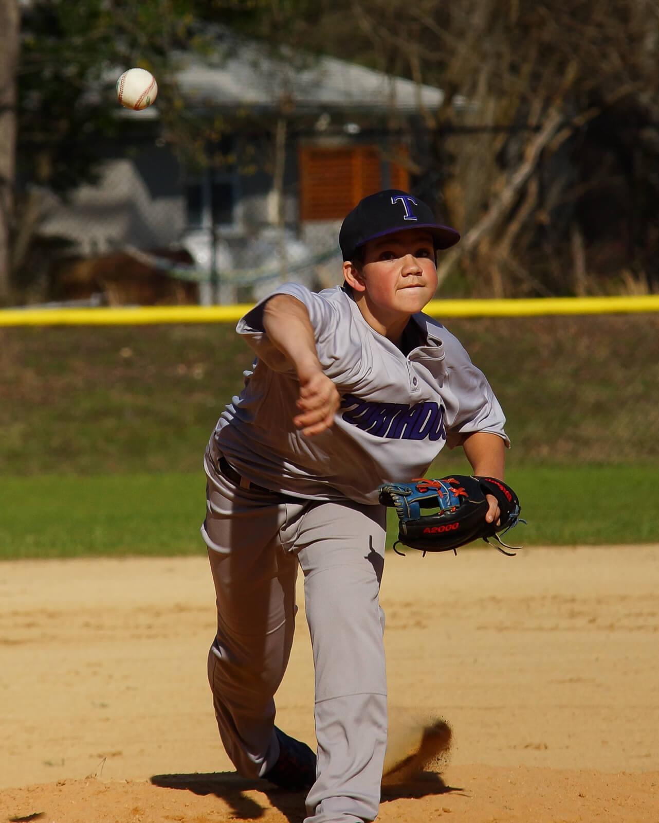 Player pitching baseball